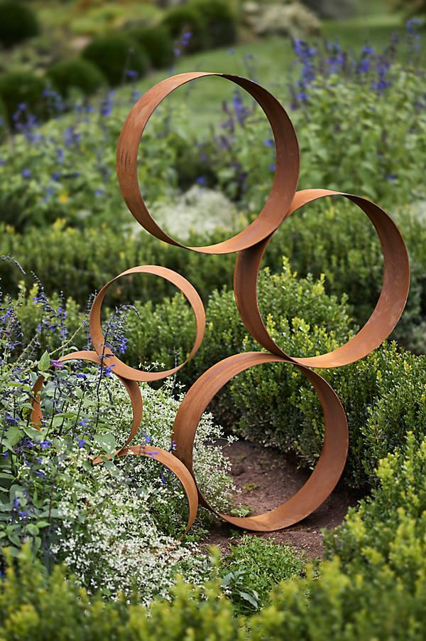 22 Stunning Nature Decor Ideas for Your Outdoor Space (You'll Love #13!) - Whimsical Metal Circles